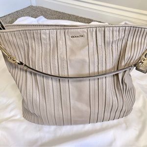 Coach taupe ribbed bag. Beautiful purple lining.